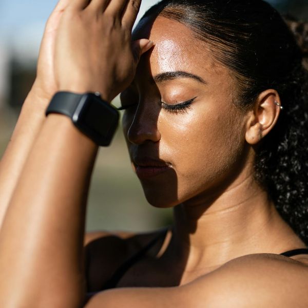 Close-up of a person breathing deeply with eyes closed, focusing on calmness.